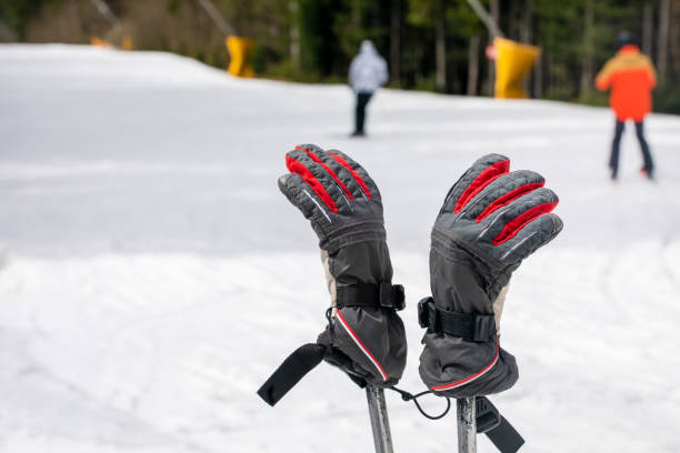 ski gloves dressed on ski poles on the slope. Leisure