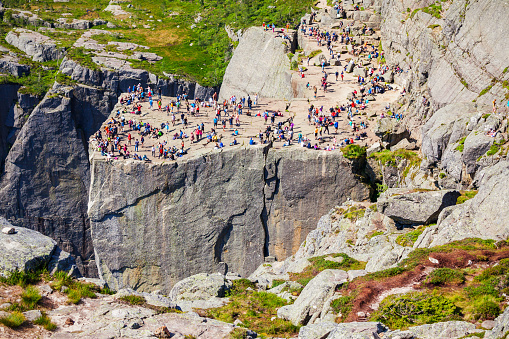 Preikestolen or Prekestolen or Pulpit Rock is a famous tourist attraction near Stavanger, Norway. Preikestolen is a steep cliff which rises above the Lysefjord.