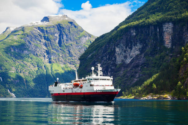 Tourist boat at the Geirangerfjord near the Geiranger village, Norway