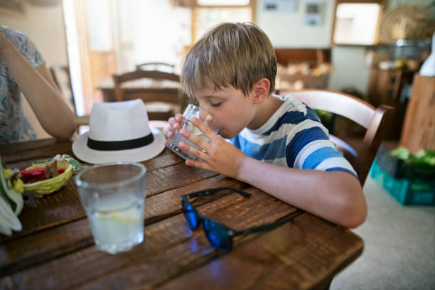 Thirsty hiker family are enjoying cold lemonade made from traditional fresh lemons grown in Amalfi region.\nShot with Nikon D850