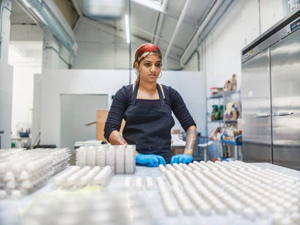 istock One female chocolatier working at the chocolate factory 2149162541