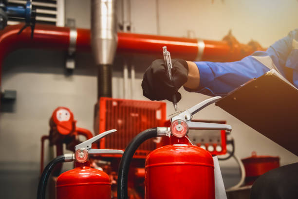istock Engineer check fire extinguisher tank in the fire control room for safety in factory or industry. 2149163183