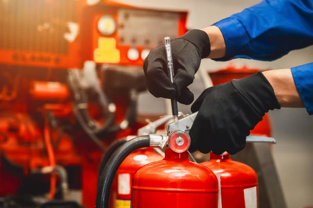 istock Engineer check fire extinguisher tank in the fire control room for safety in factory or industry. 2149163196