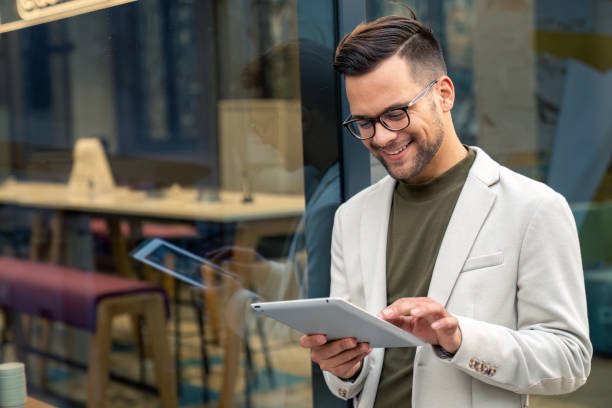 istock Young business man manager wearing suit using digital tablet 2149163579