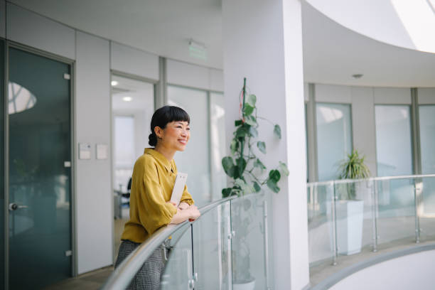 istock Asian corporate employee portrait in office environment 2149163580