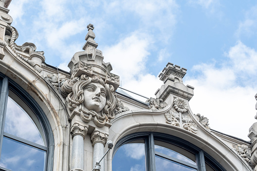 Close-up view of the ornate facade of the historic building once known as Grosshandelshaus Schlesinger and Grünbaum, showcasing intricate Art Nouveau detailing up close