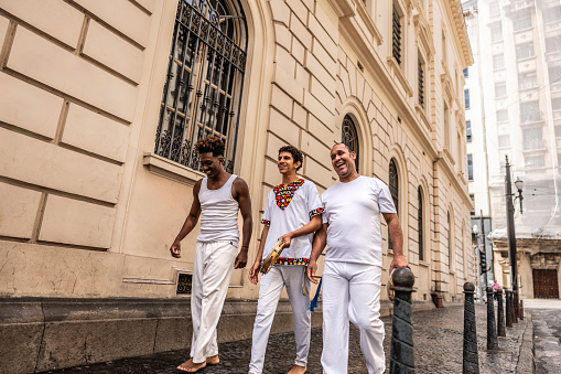 Capoeiristas talking and walking in Sao Paulo, Brazil