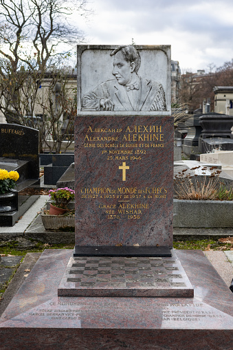 A grave of Alexander Alekhine on Montparnasse Cemetery, Paris, France. He was a Russian and French chess player and the fourth World Chess Champion, a title he held for two reigns.
