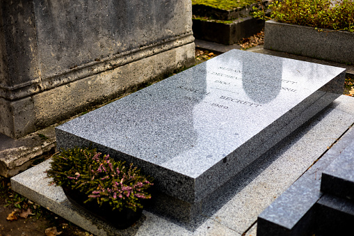 A grave of Samuel Beckett on Montparnasse Cemetery, Paris, France. He was an Irish novelist, dramatist, short story writer, theatre director, poet, and literary translator, was awarded Nobel Prize