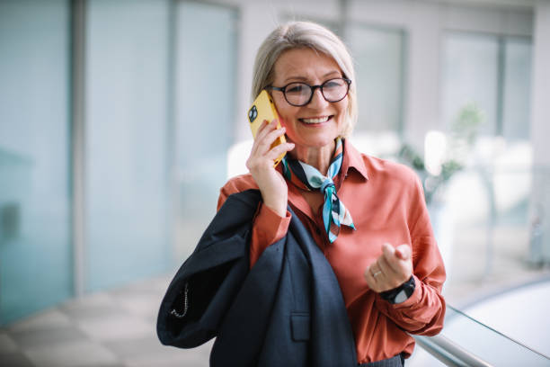 istock Female senior manager on the phone in the office 2149164281