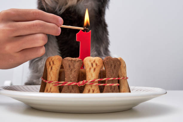 istock Faceless person with burning candle at table 2149164927