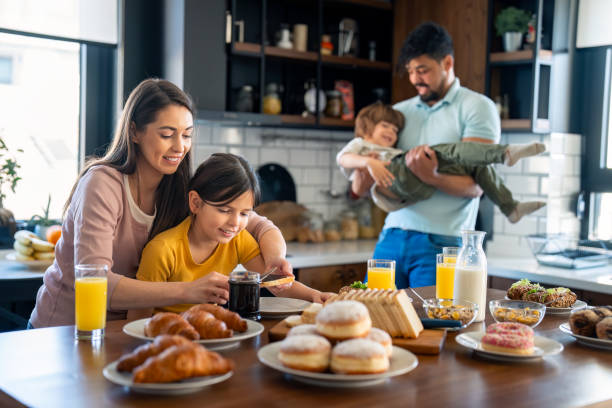 istock Happy playful family at breakfast 2149165723