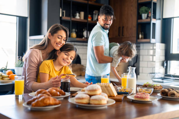 istock Playful family having breakfast together 2149165769