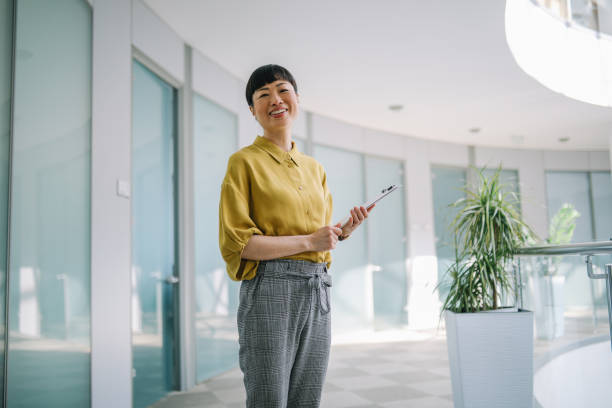 istock Asian corporate employee portrait in office environment 2149167996