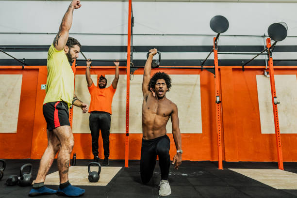 istock Men exercising with kettlebell at the gym 2149169311