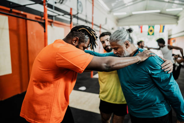 Men stretching at the gym
