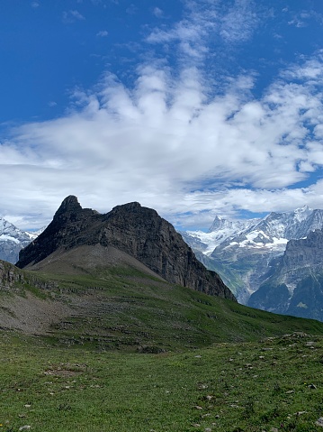 Alpine peak with burst of clouds