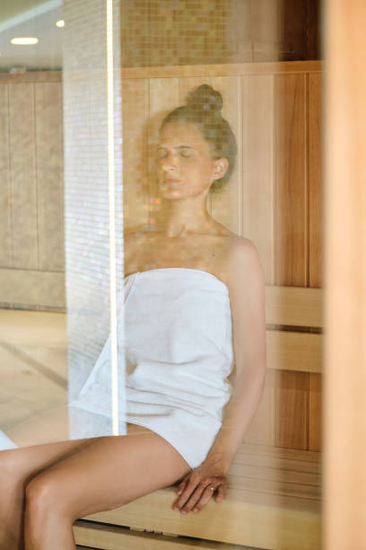 istock Female sitting in sauna in spa center 2149169693