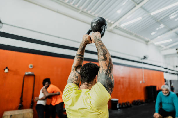 istock Men exercising with kettlebell at the gym 2149170276