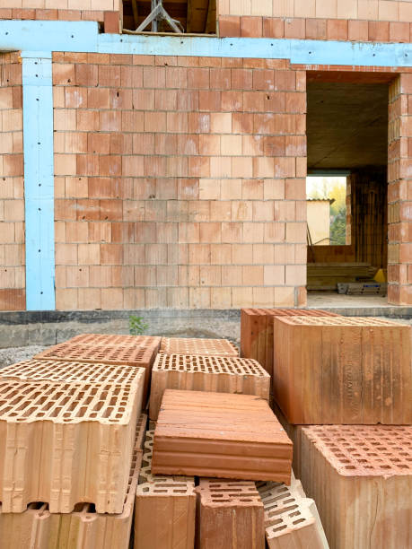 istock Multi storey family house under construction with close up bricks 2149171165