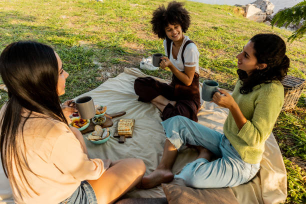 istock Young women talking on picnic outdoors 2149171191