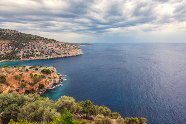 Scenic landscape featuring a cloudy sky filled with dark storm clouds