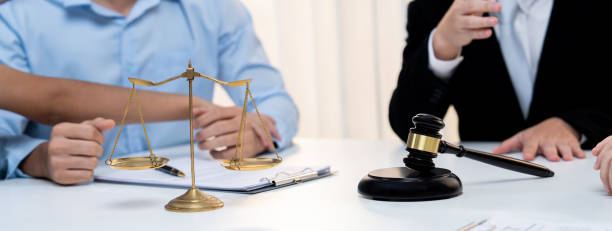 istock Lawyer acting as mediator broke a compromise between two parties. Rigid 2149174492