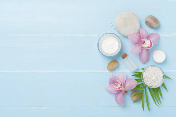 istock Composition with orchids, spa products on wooden background, top view 2149176970