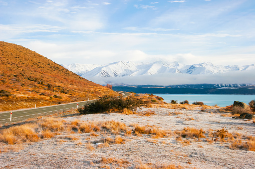 A road stretches into the distance as it winds it's way through the spectacular scenery in New Zealand's South Island