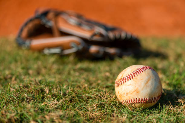 istock Well worn baseball on grass field 2149178760