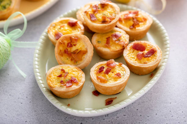 istock Mini quiches with ham and cheese topped with crispy bacon 2149179061