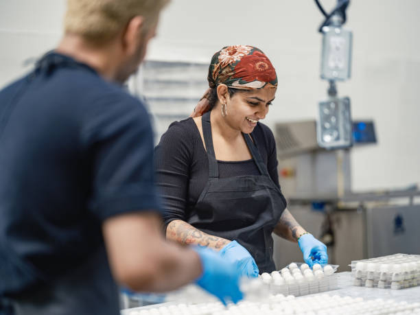 istock Two chocolatiers working at the chocolate factory 2149180086