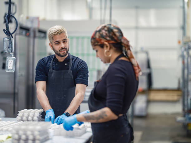 istock Two chocolatiers working at the chocolate factory 2149180089