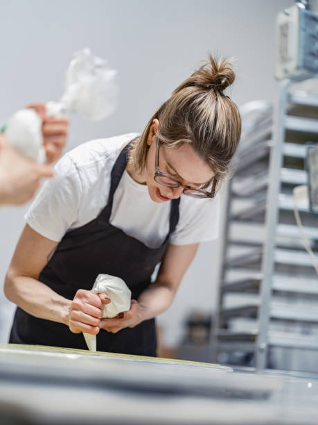 istock One female chocolatier working at the chocolate factory 2149180101
