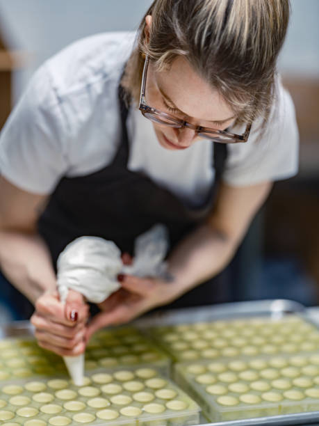 istock One female chocolatier working at the chocolate factory 2149180106