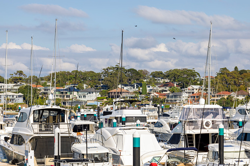 Moored motorboats at marina, Sydney Australia, background with copy space, full frame horizontal composition