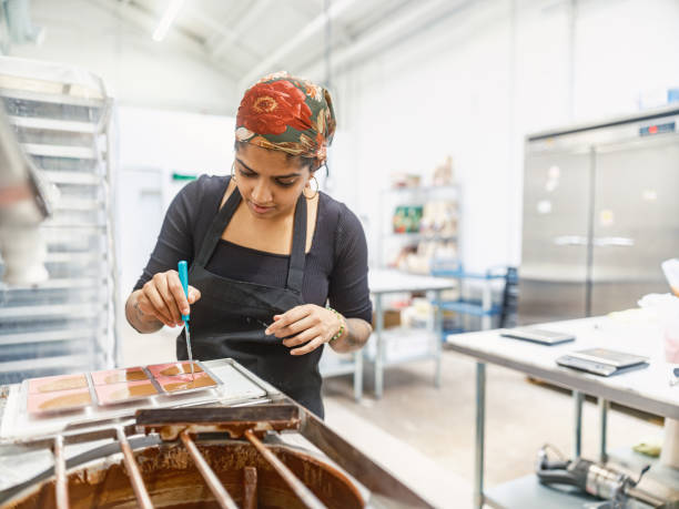 istock Indian Female chocolatier working at the chocolate factory 2149180424