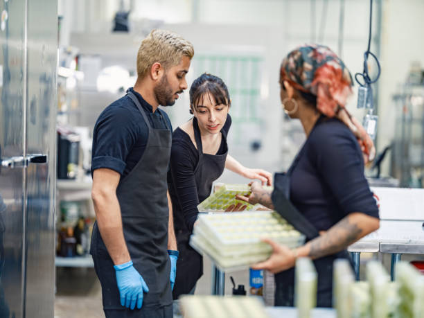 istock Chocolatiers working at the chocolate factory 2149180694