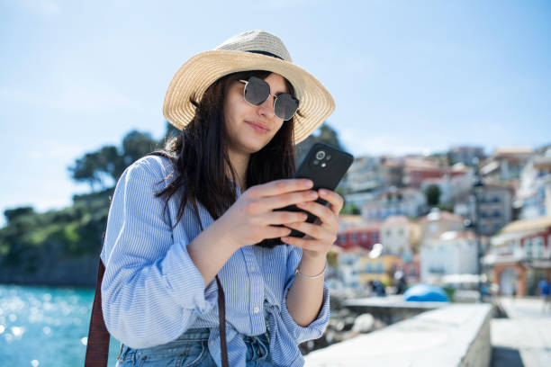 istock Young woman on vacation using smartphone. 2149181420