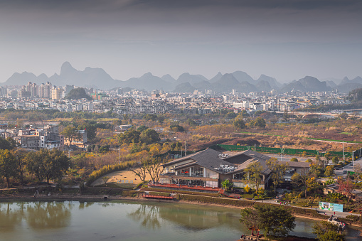 City buildings and mountains scenery in Guilin, Guangxi, China. Afternoon background picture with copy space
