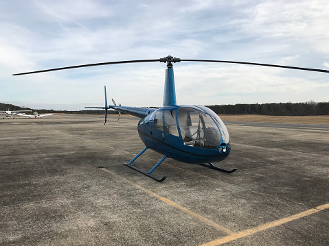 Annapolis, MD, USA: A Robinson 44 light helicopter sitting on the tarmac.