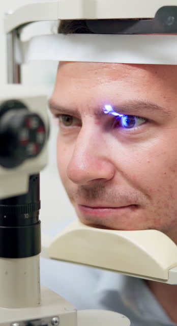 Eye test, man and optometry for vision, medical and healthcare consultation with glaucoma, lens or iris check. Patient with split lamp, blue light or laser machine for scanning in ophthalmology exam