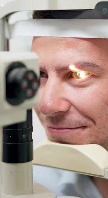 Eye exam, man and optometry for vision, medical and healthcare consultation with glaucoma, lens or iris check. Patient with split lamp, light or laser tech machine for scanning in ophthalmology test
