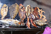 Close-up of fish being grilled