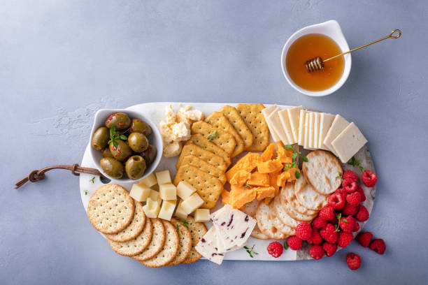 istock Small cheese and cracker board with fresh berries and olives 2149187711