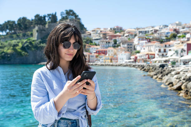 istock Young woman on vacation using smartphone. 2149188667