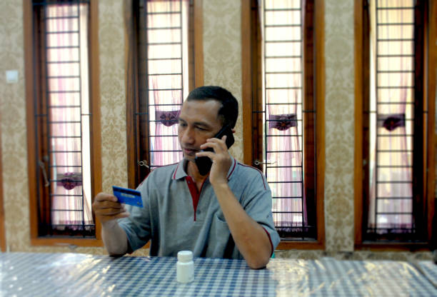 A man is interacting with healthcare at home.