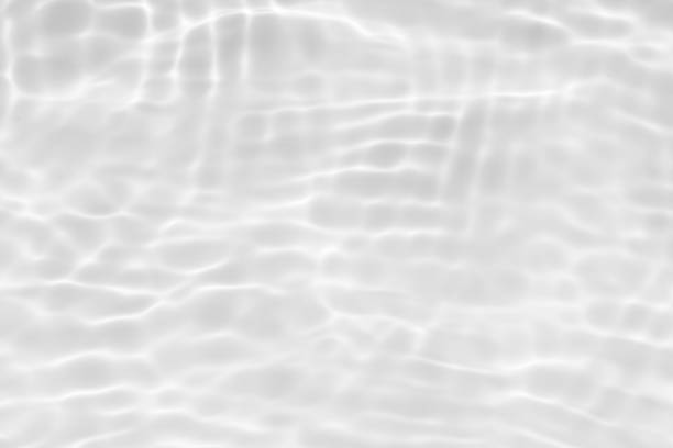 istock Bluewater waves on the surface ripples blurred. Defocus blurred transparent blue colored clear calm water surface texture with splash and bubbles. Water waves with shining pattern texture background. 2149191584