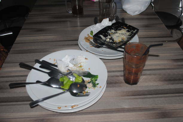 Dirty plates and spoons on the restaurant table.