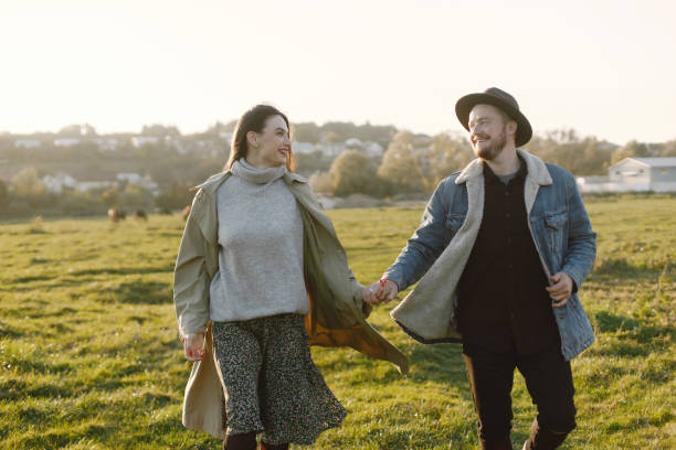 istock Stylish romantic couple walking in a field and posing for a photo 2149192721